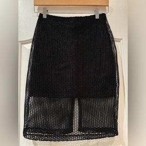 Mika & Gala women’s black netted mini skirt. Size small. Brand new!